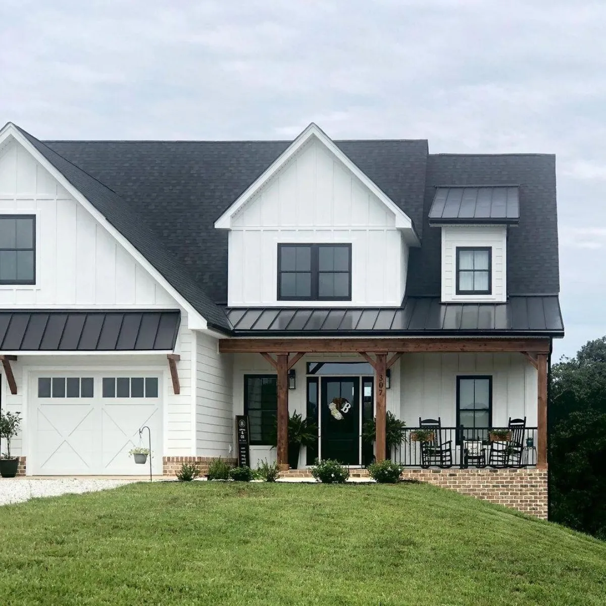 White farmhouse carriage house garage door on a country home